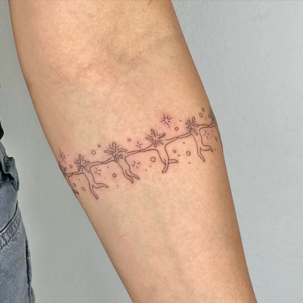 Reindeer sleigh tattoo design, anime style, on the forearm, running in a line of seven with connecting antlers, surrounded by small stars and dots
