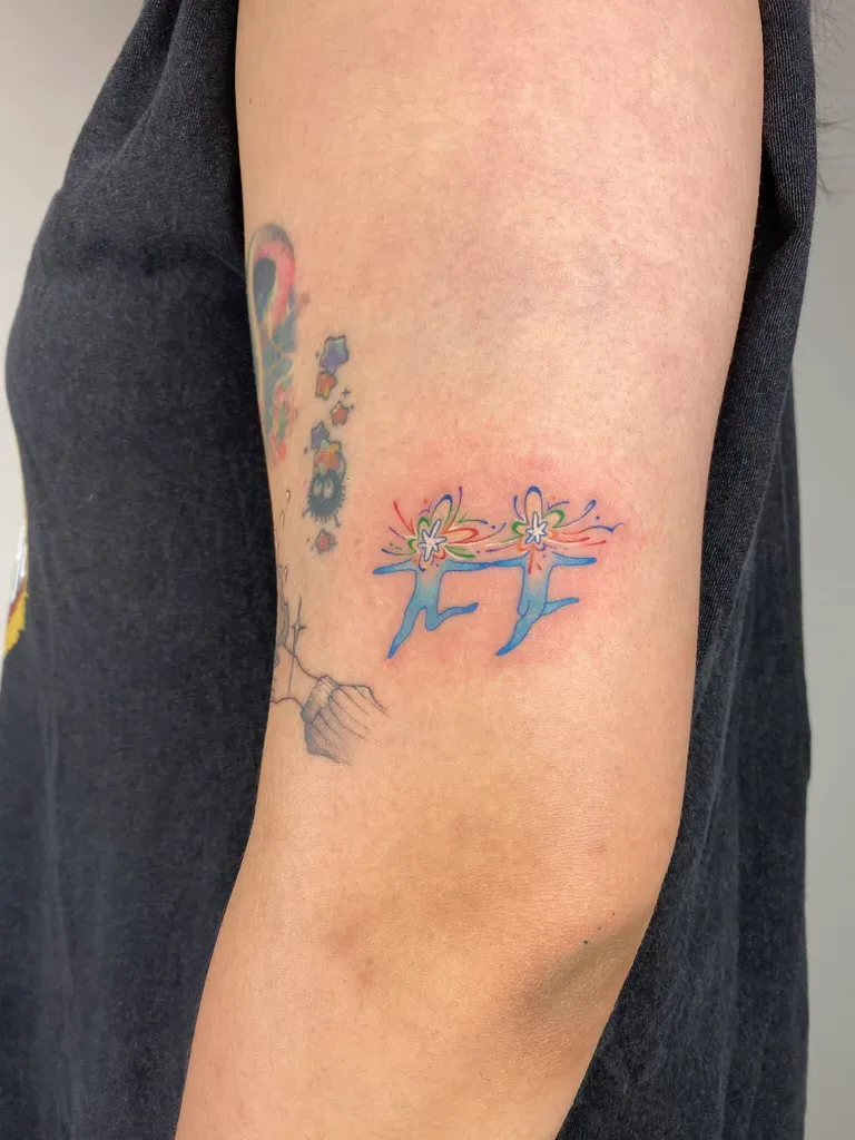 Deer tattoo design, anime style, on the thigh, with abstract rainbow flowers sprouting from their backs