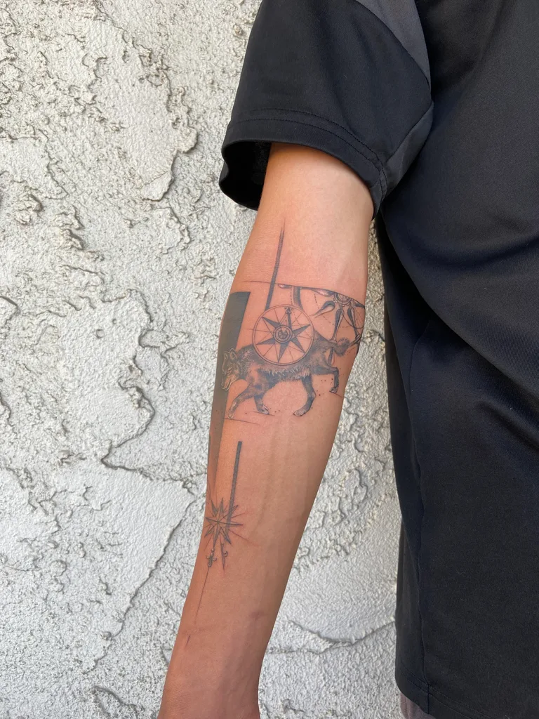Wolf and wheel tattoo design, illustrative style, on the forearm, a wolf carrying a spoked wheel on its back, with thin vertical lines and a starburst below