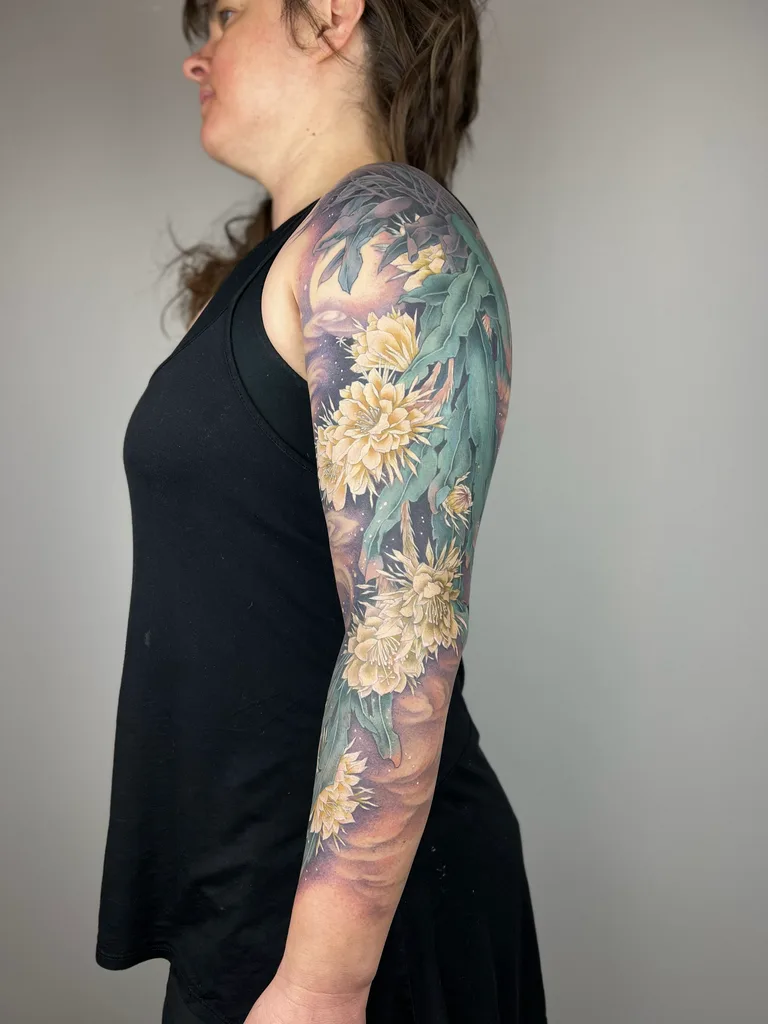 Chrysanthemums tattoo design for women, illustrative style, on the full sleeve, cream chrysanthemums with teal willow leaves over a muted purple ground