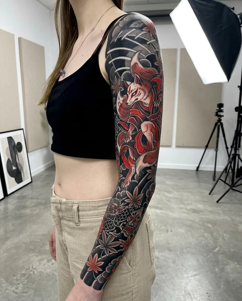 Kitsune fox tattoo design for women, Japanese style, on the full sleeve, in dark tones with red and orange accents, surrounded by autumn leaves and clouds