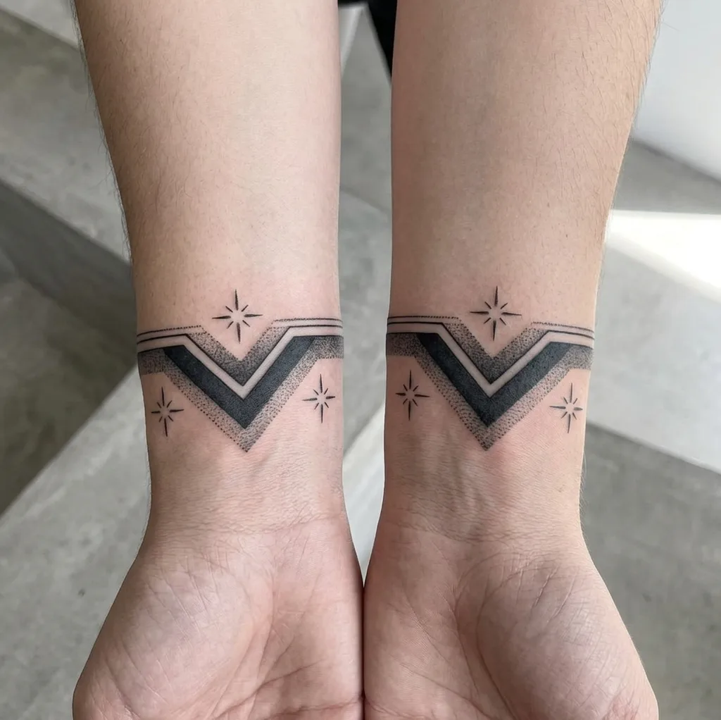 Geometric band tattoo design for women, minimalist style, on the ankle, with a black V shape and star accents, on both wrists