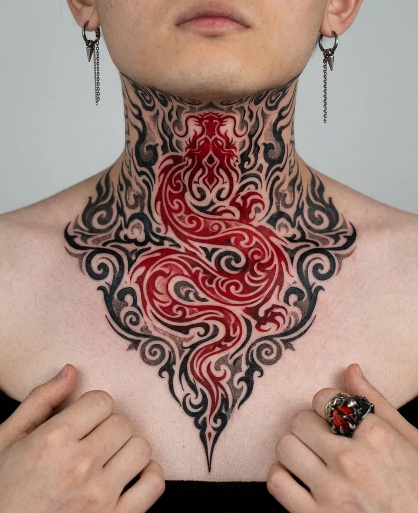 Dragon tattoo design, ornamental style, on the neck, of a red dragon surrounded by black and grey scrollwork, extending up from the chest