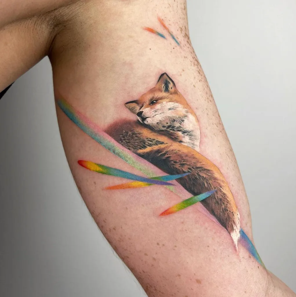 Fox rainbow tattoo design for men, realism style, on the bicep, with a rainbow aura around its head and body